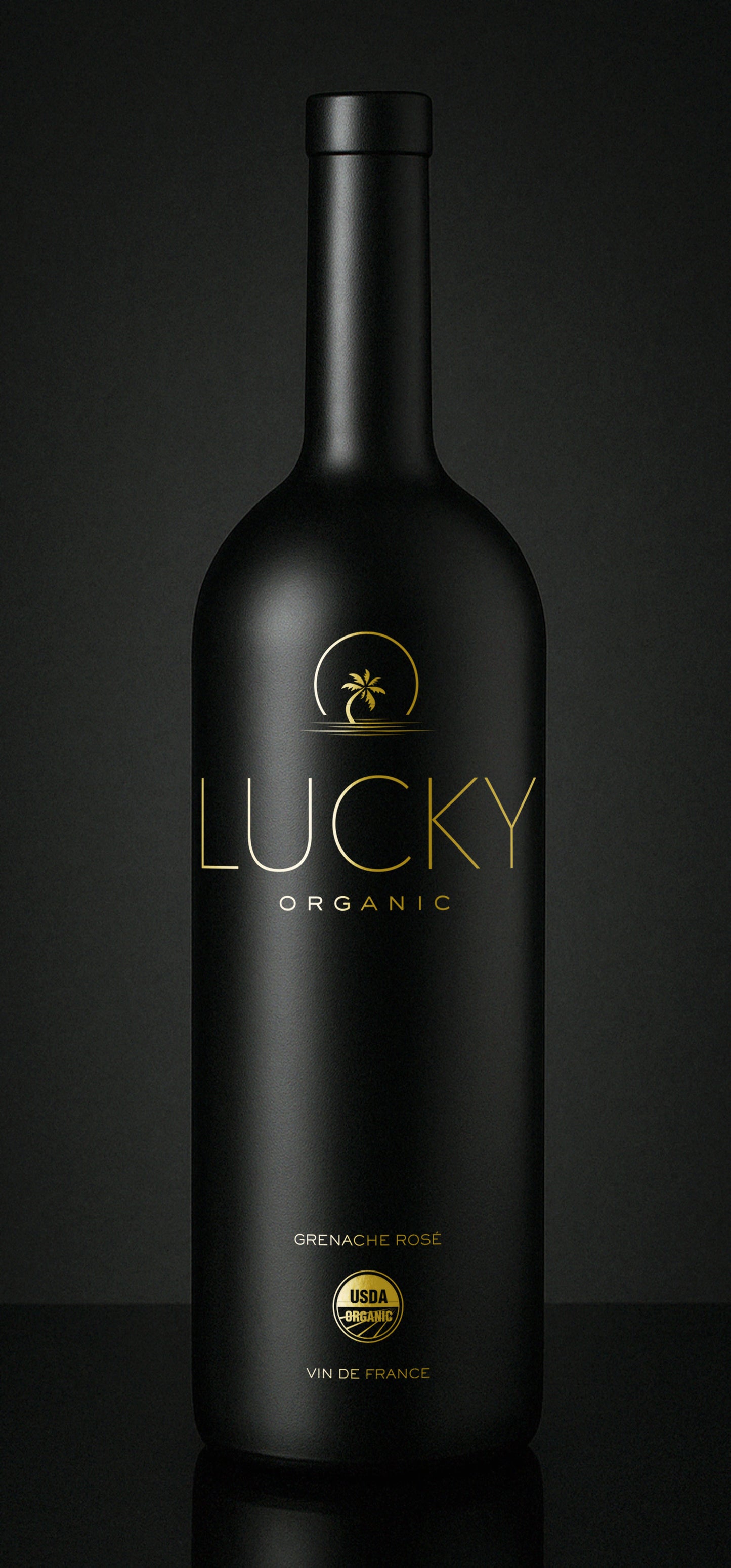 Black wine bottle with 'Lucky Organic' branding on a dark background